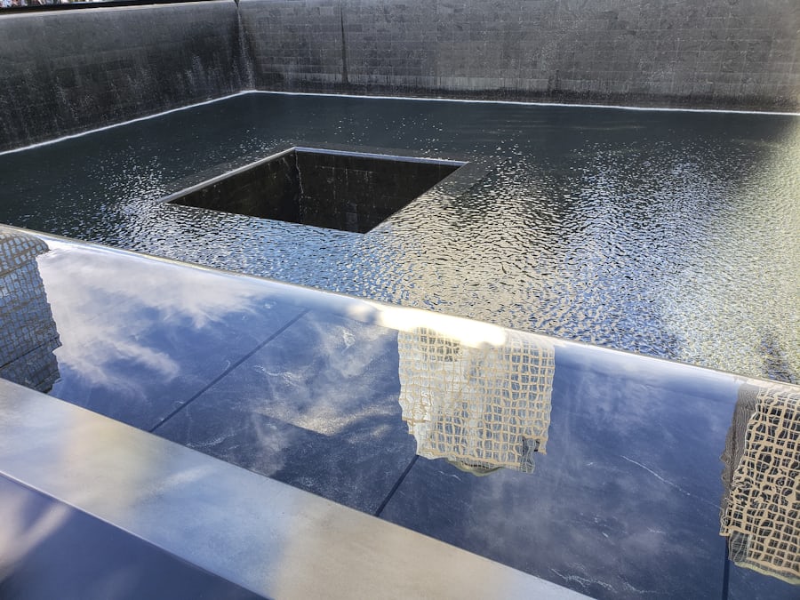 9/11 Memorial reflecting pool with cascading water at Ground Zero, New York City